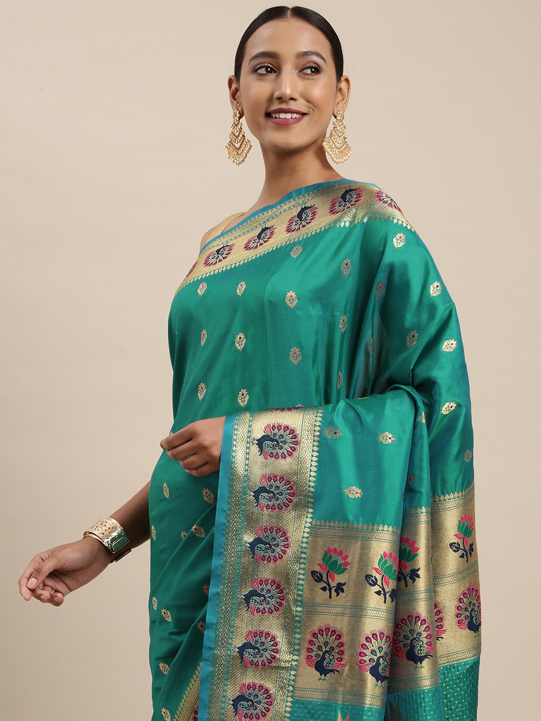 

Mitera Teal & Golden Ethnic Motif Woven Design Saree