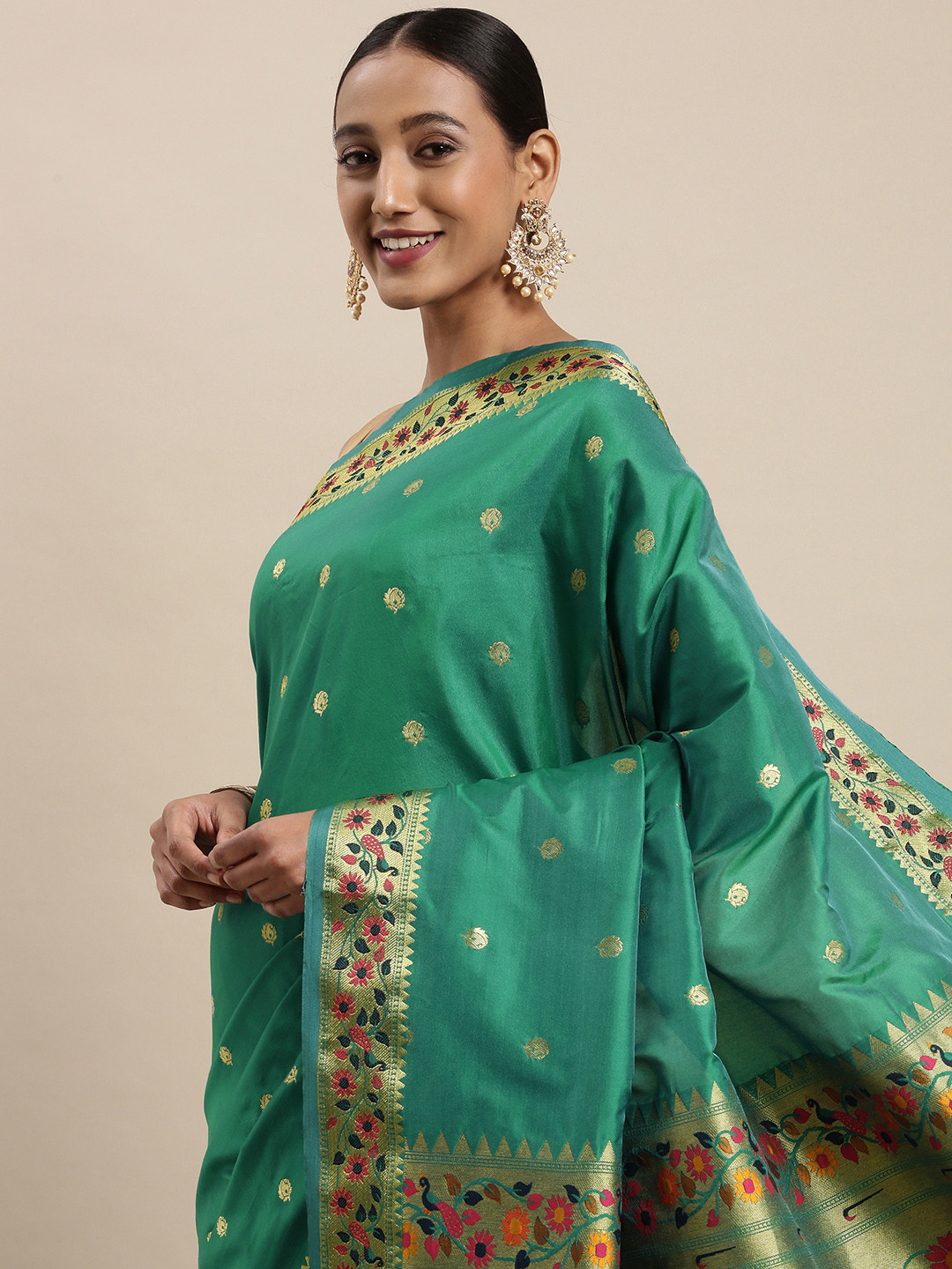 

Mitera Sea Green & Golden Ethnic Motifs Woven Design Saree