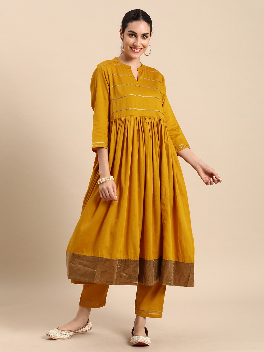 

Anouk Women Mustard Yellow Striped Empire Gotta Patti Pure Cotton Kurta with Trousers