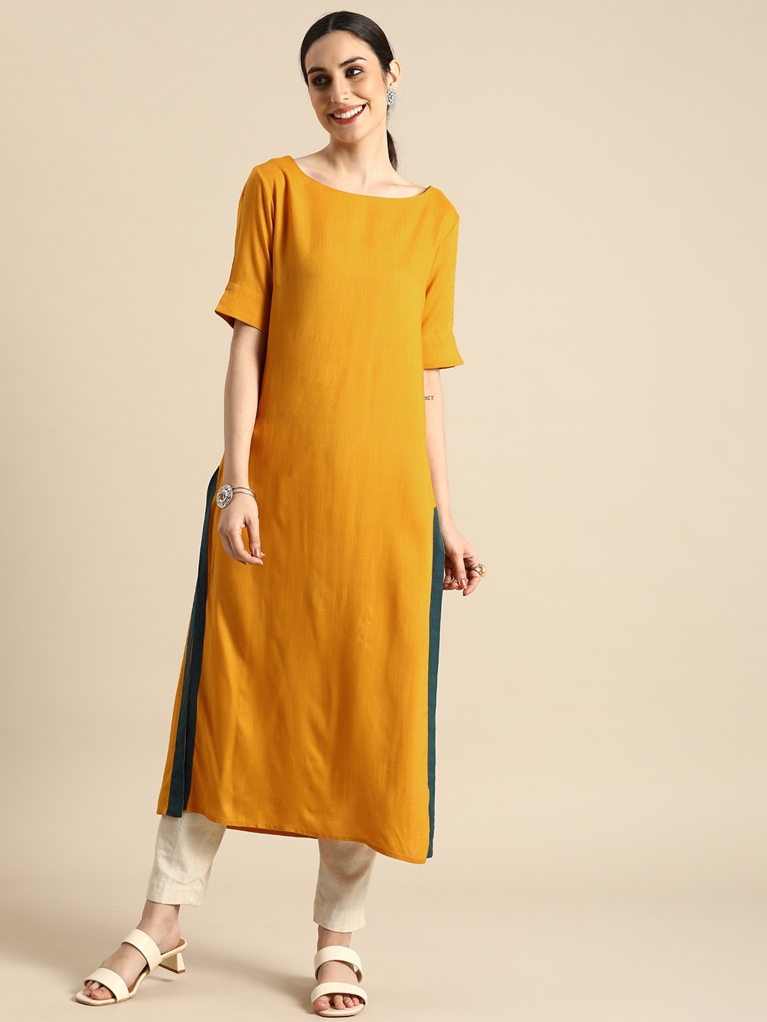

Anouk Women Mustard Yellow Solid Round Neck Kurta