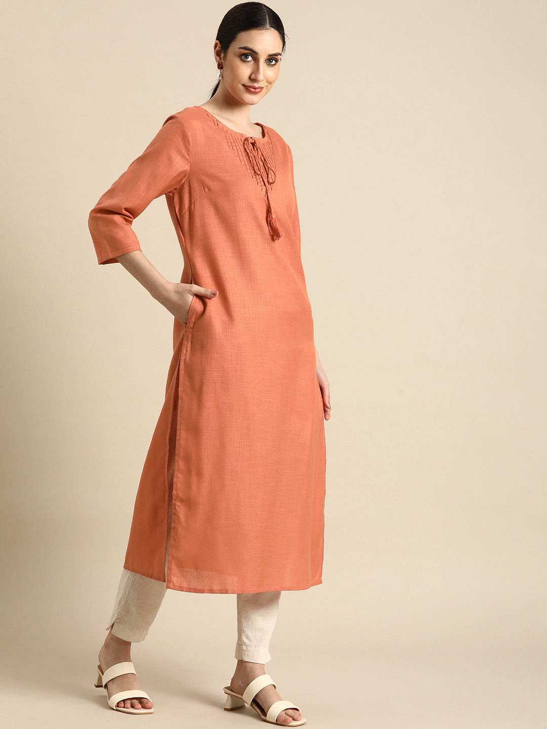 

Anouk Women Peach-Coloured Solid Tie- Up Neck Kurta With Pleated Yoke