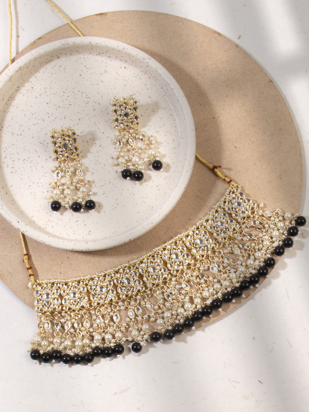 

AccessHer Gold-Toned Black Kundan Studded Enamelled Jewellery Set With Pearls