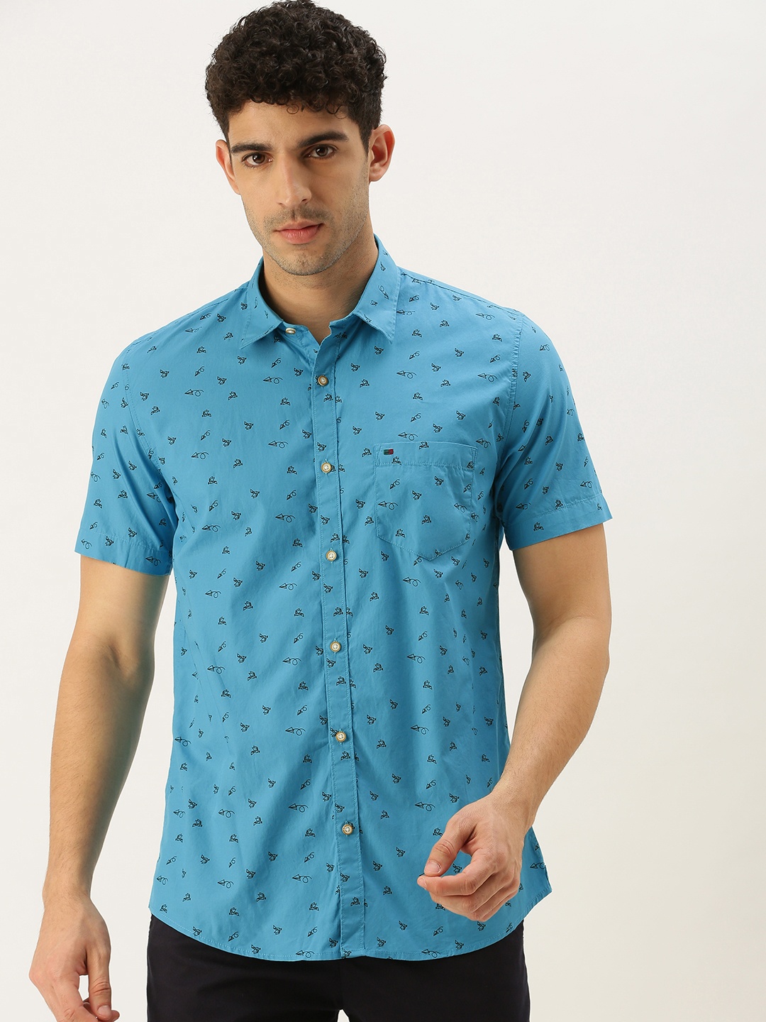 

Peter England Casuals Men Turquoise Blue & Black Slim Fit Printed Pure Cotton Casual Shirt