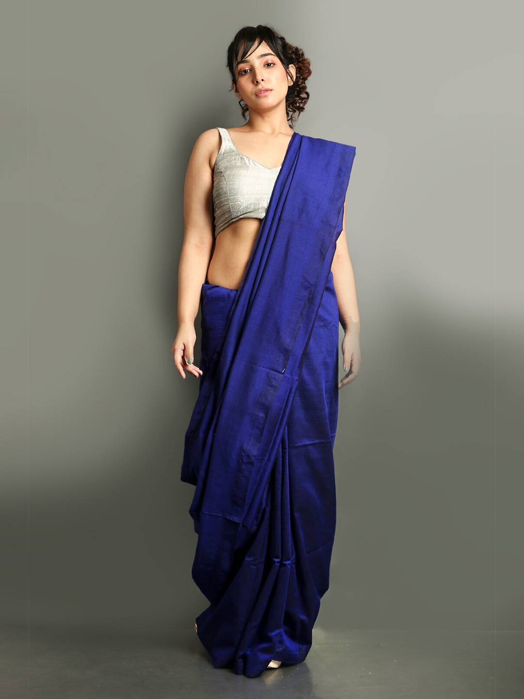 

Charukriti Blue Solid Saree