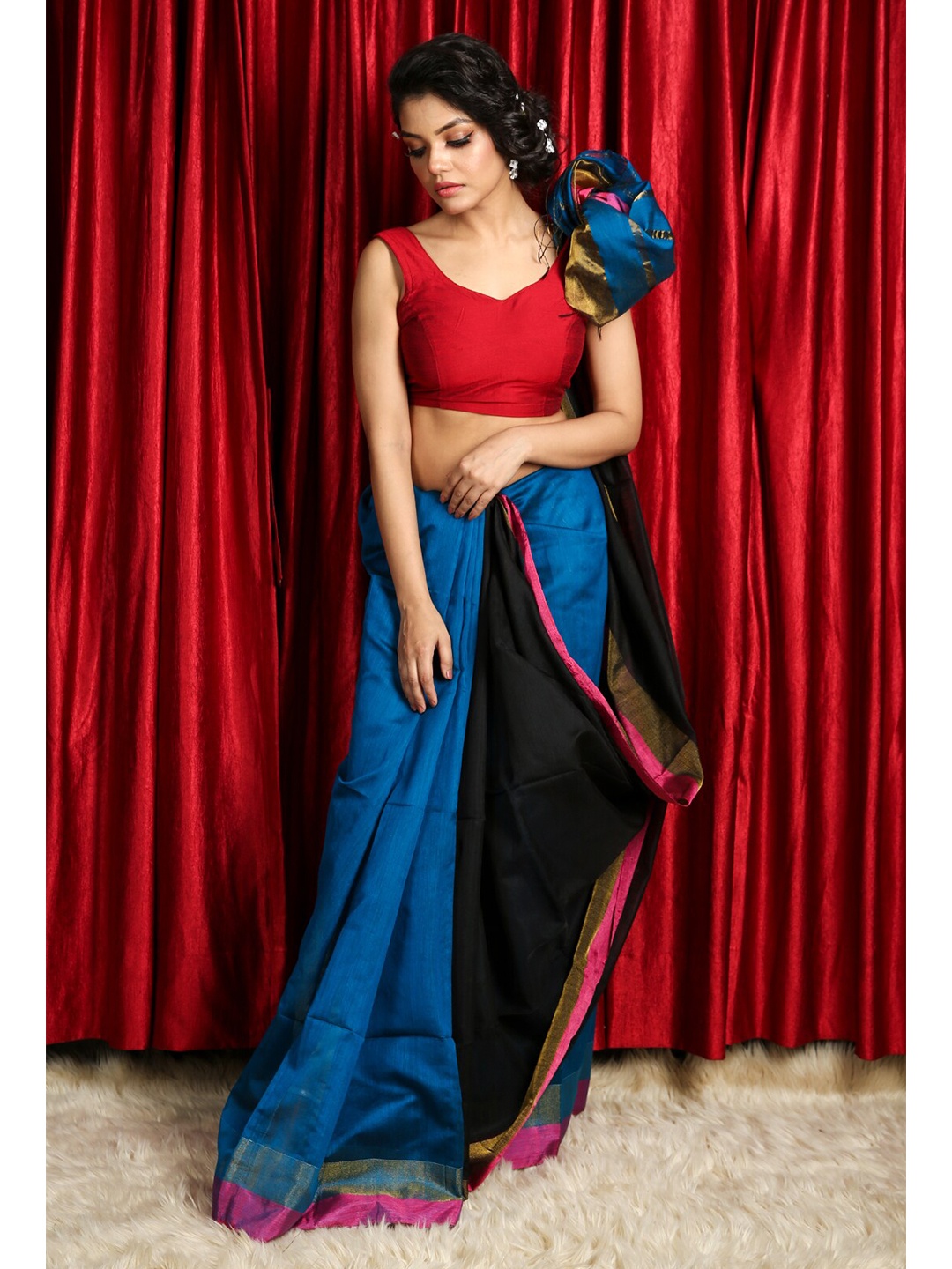 

Charukriti Blue & Pink Woven Zari Saree