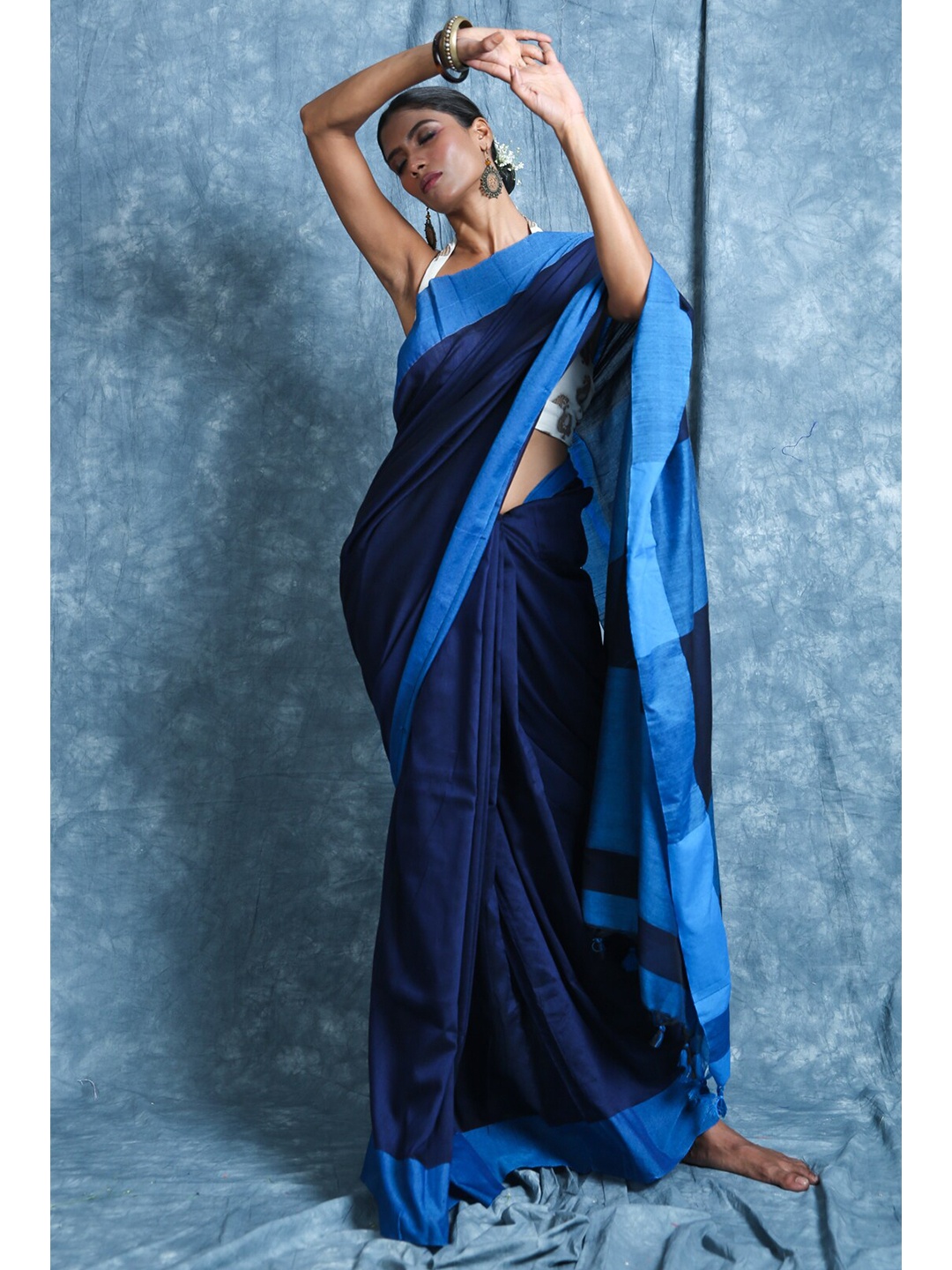 

Charukriti Blue Solid Cotton Handloom Saree