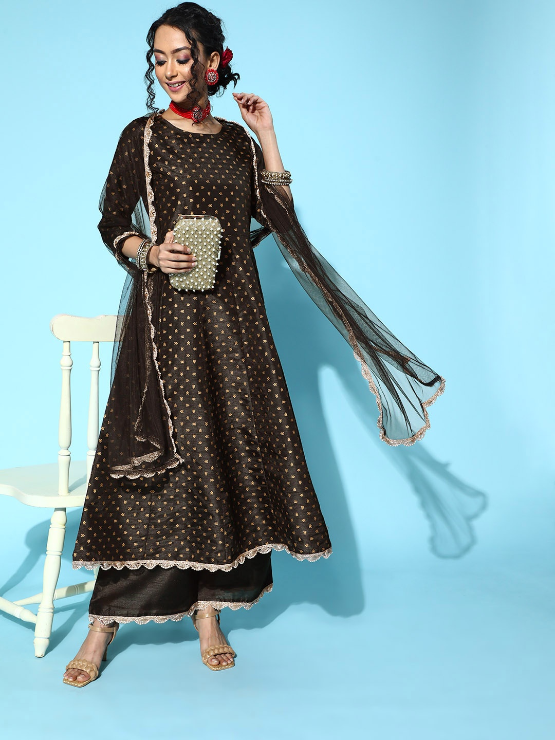 

Ahalyaa Ethnic Motifs Art Silk Swirling Volume Kurta Set, Black