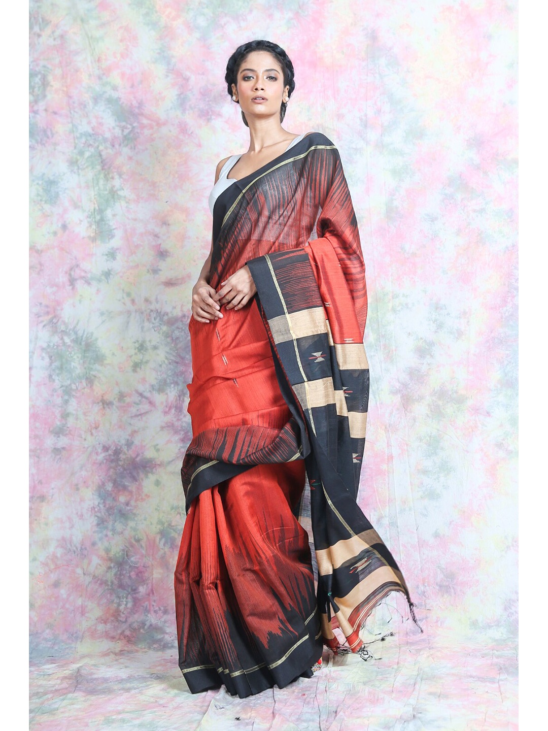 

Charukriti Rust & Black Printed Cotton Blend Handloom Saree