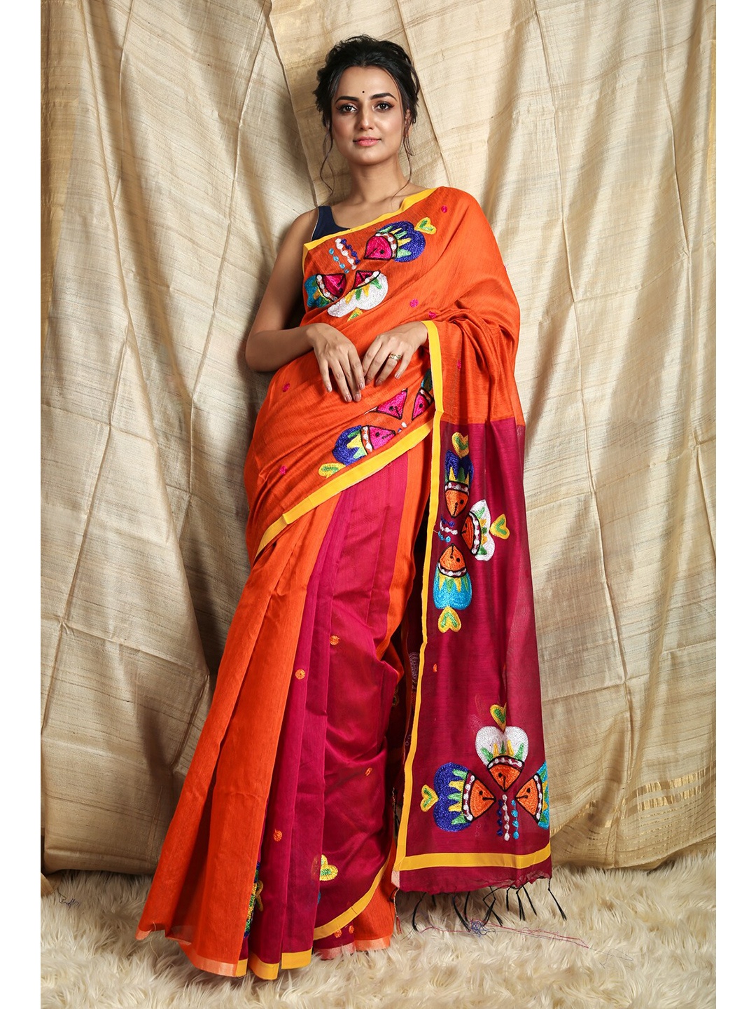 

Charukriti Orange & Pink Embroidered Saree