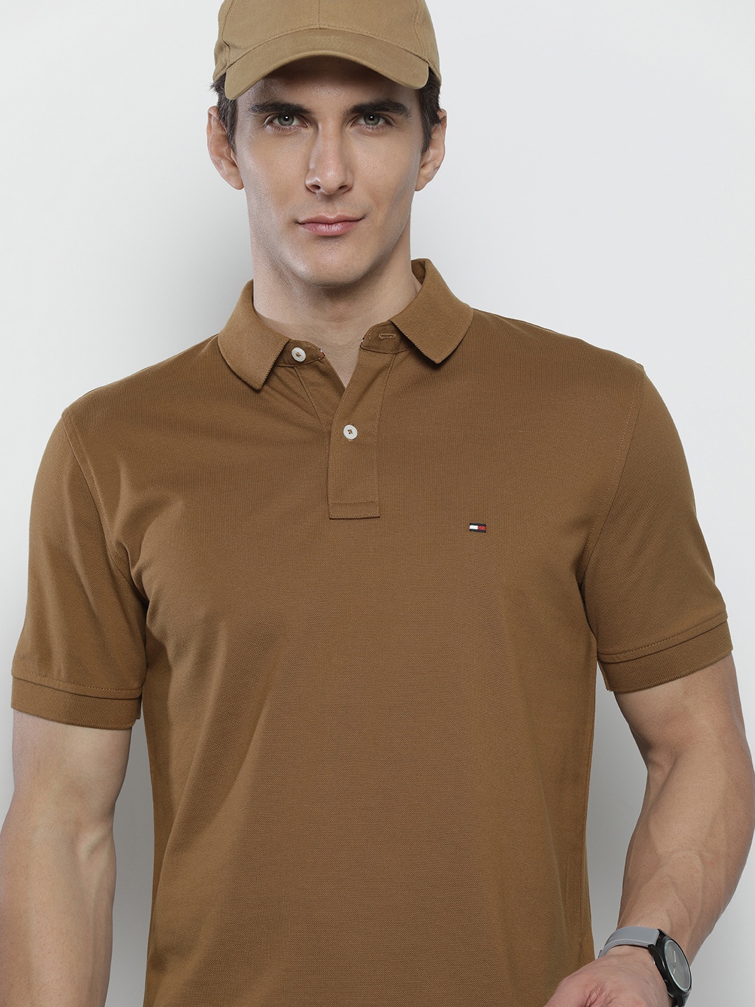 

Tommy Hilfiger Men Brown Solid Polo Collar Pure Cotton T-shirt