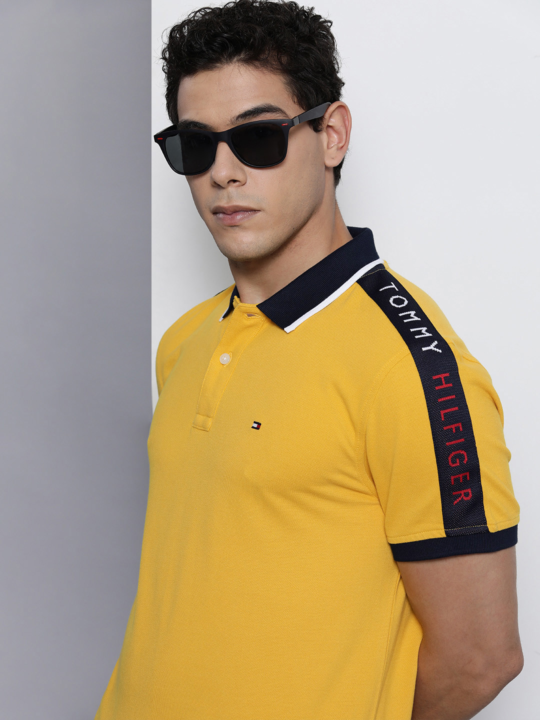 

Tommy Hilfiger Men Yellow Solid Polo Collar Pure Cotton Casual T-shirt With Branded Tape