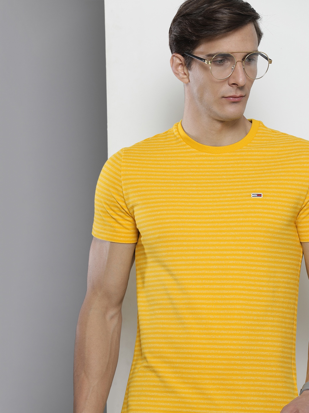 

Tommy Hilfiger Men Yellow Striped Round Neck Slim Fit T-shirt