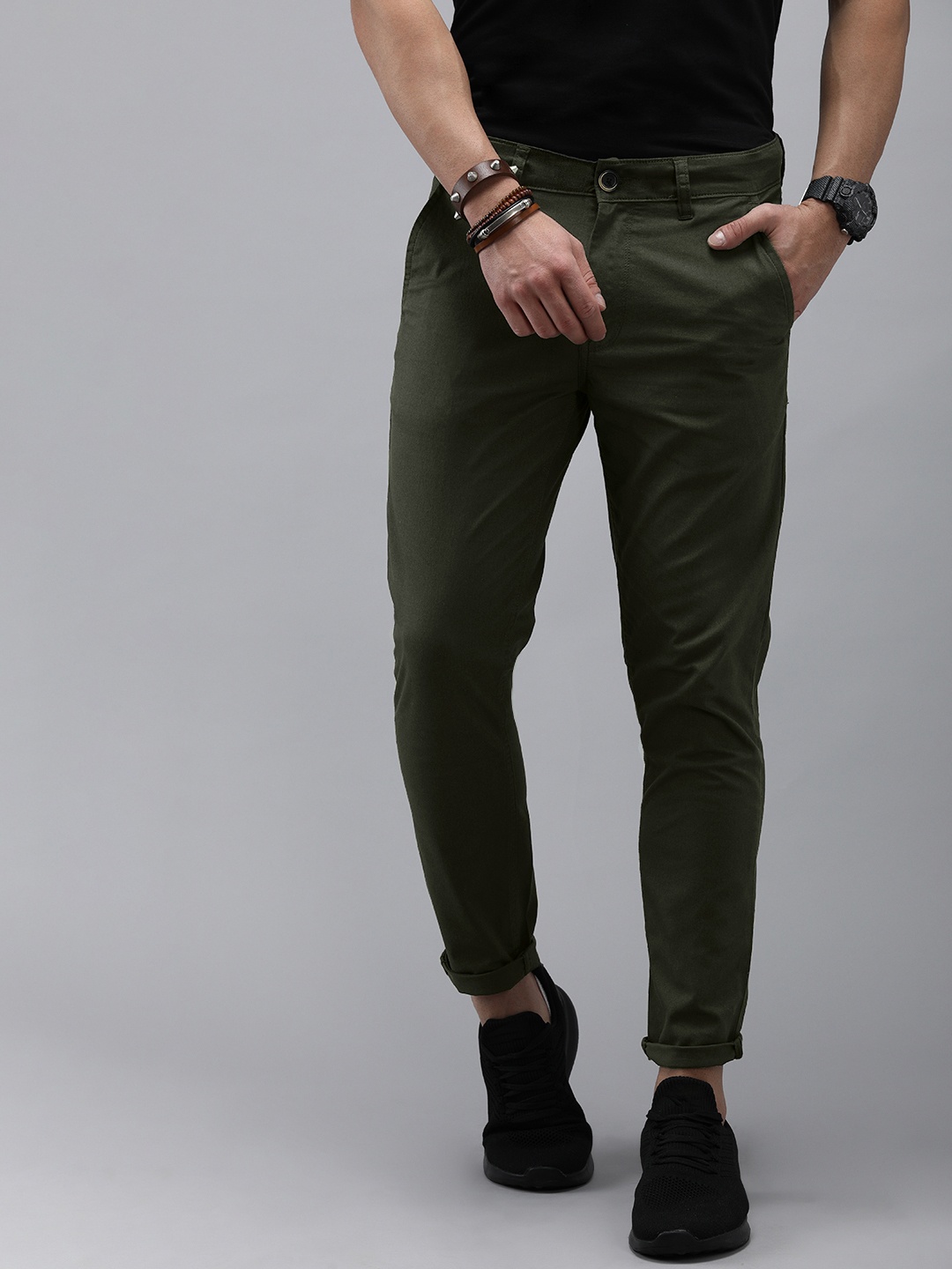 

The Roadster Lifestyle Co Men Green Solid Tapered Fit Trousers