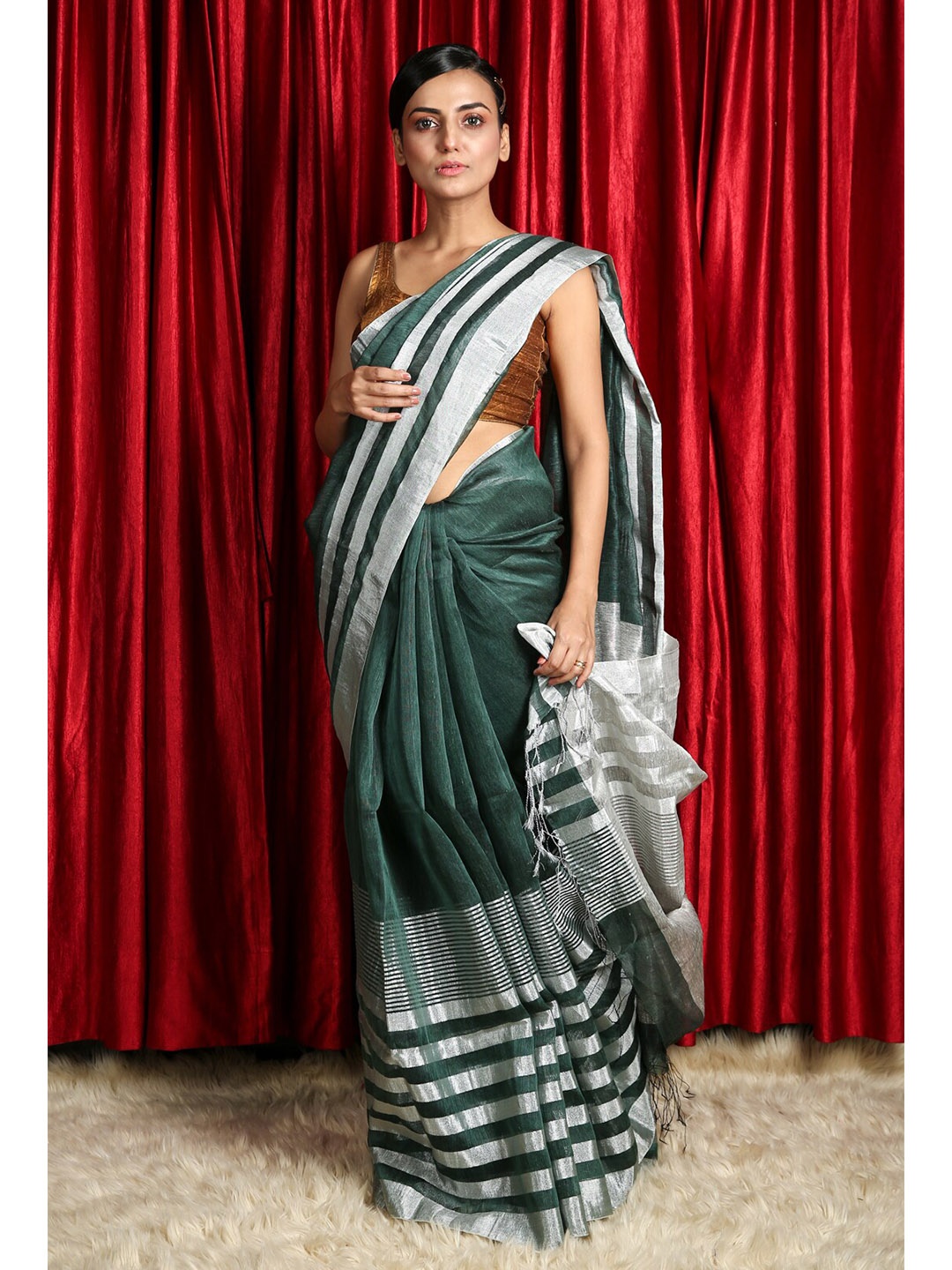 

Charukriti Green & Silver-Toned Striped Zari Linen Blend Saree