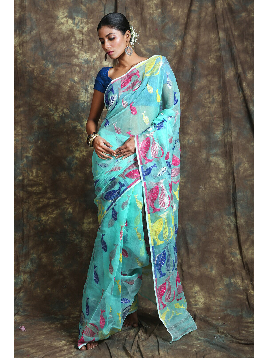 

Charukriti Blue & Yellow Floral Zari Silk Cotton Jamdani Saree