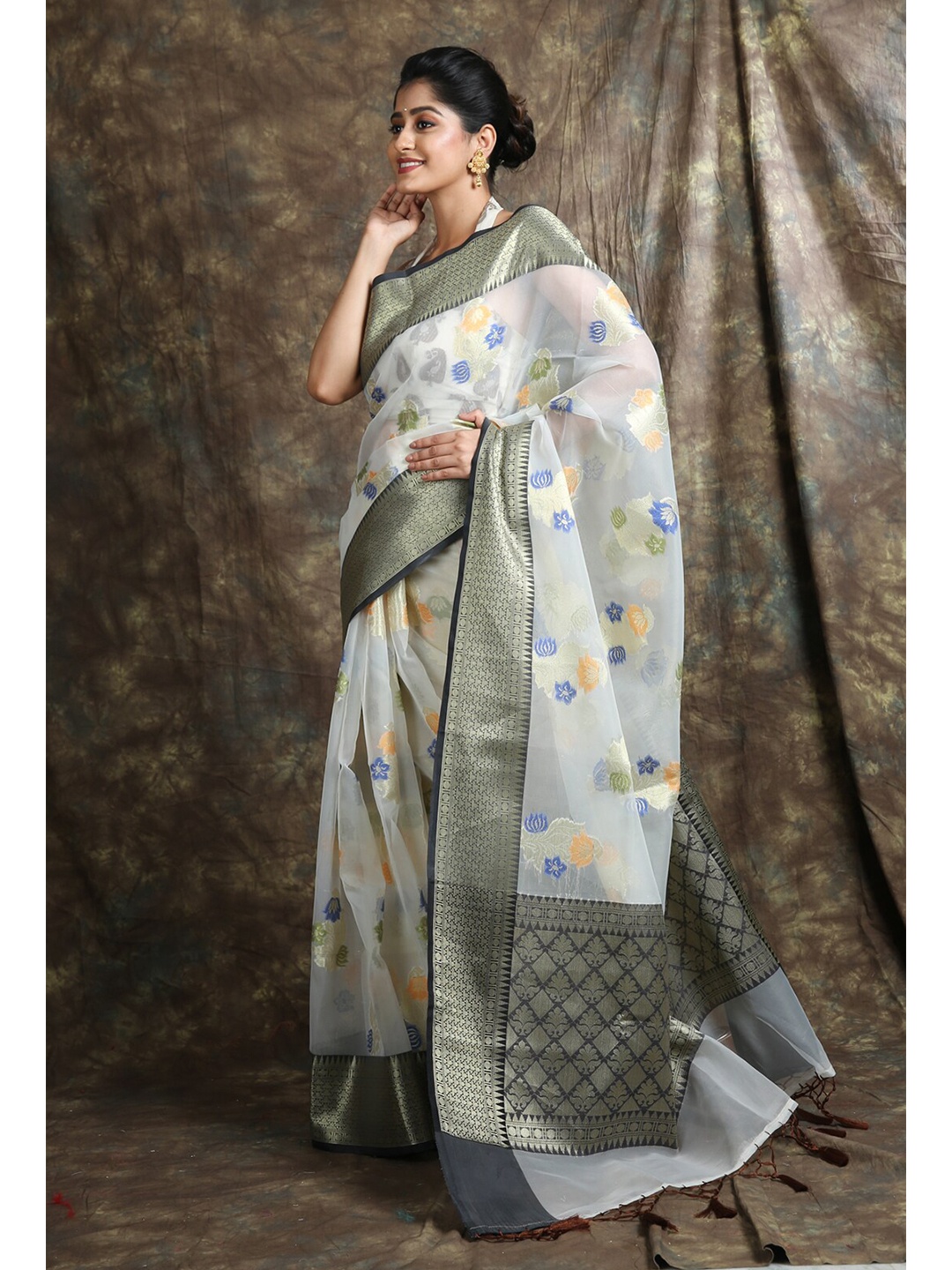 

Charukriti White & Blue Woven Design Zari Organza Saree