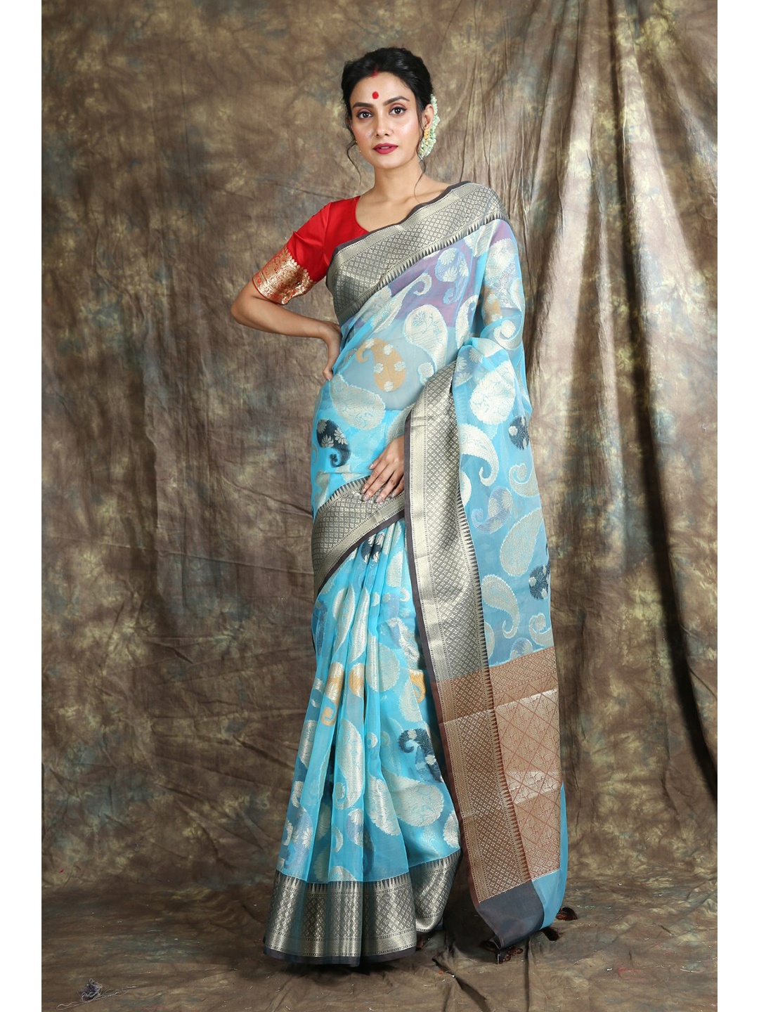 

Charukriti Blue & Silver-Toned Paisley Zari Organza Saree