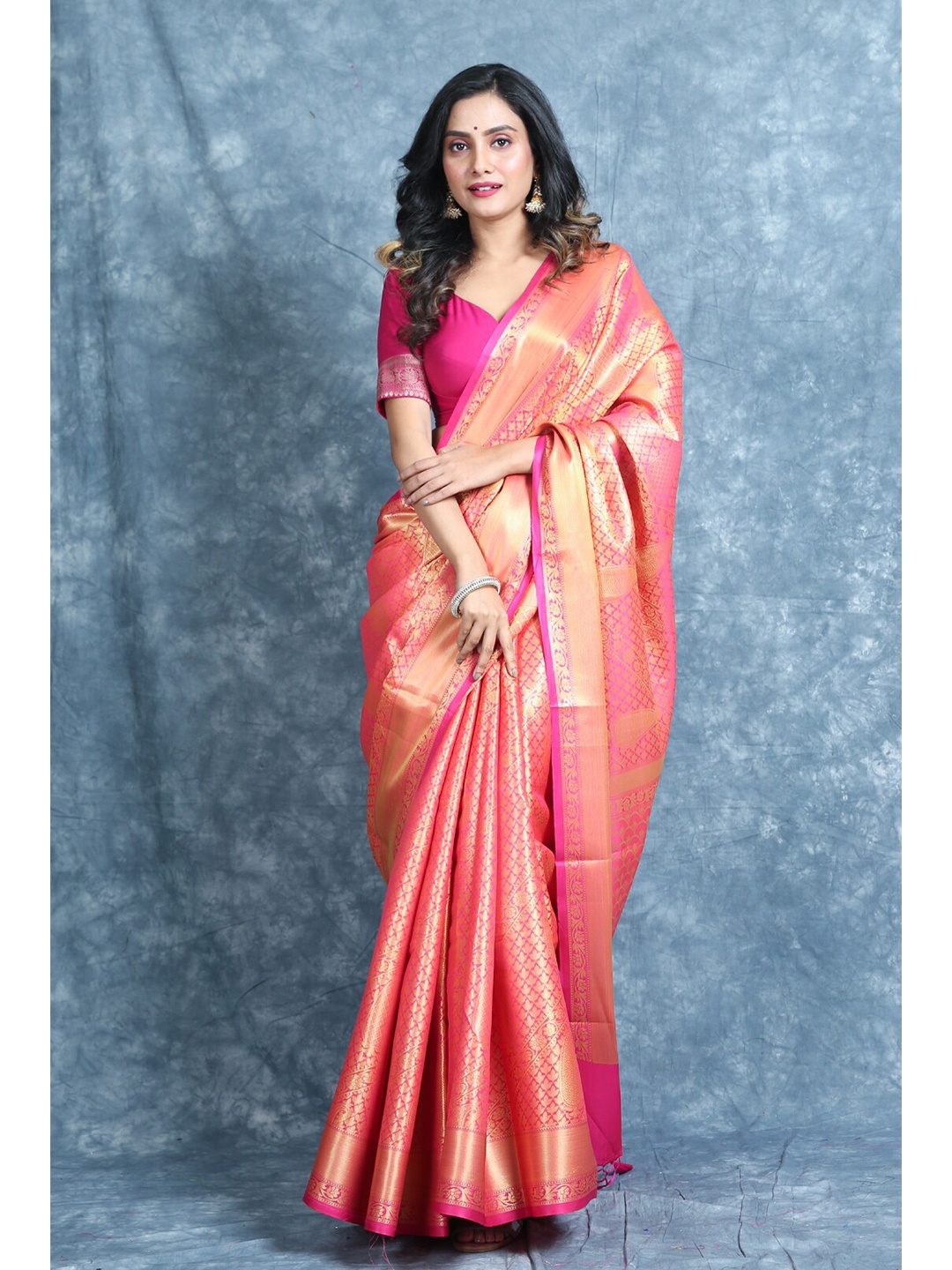 

Charukriti Orange & Pink Ethnic Motifs Zari Brocade Saree