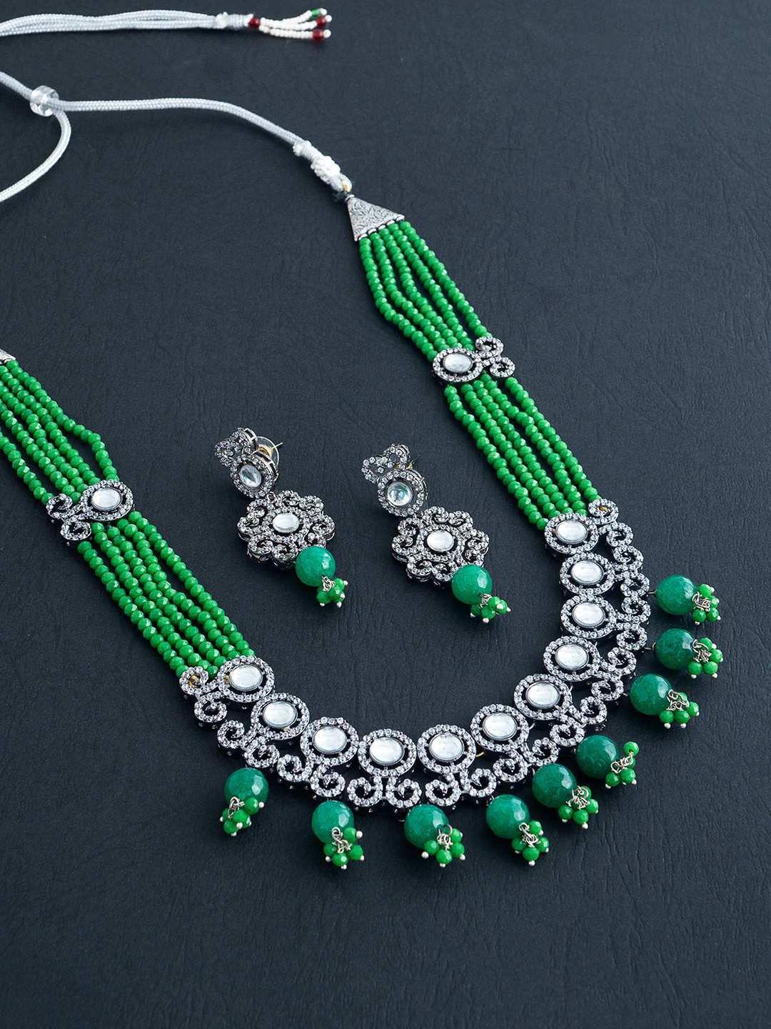 

Golden Peacock Women Green & Silver Stone-Studded & Pearls Jewellery Set