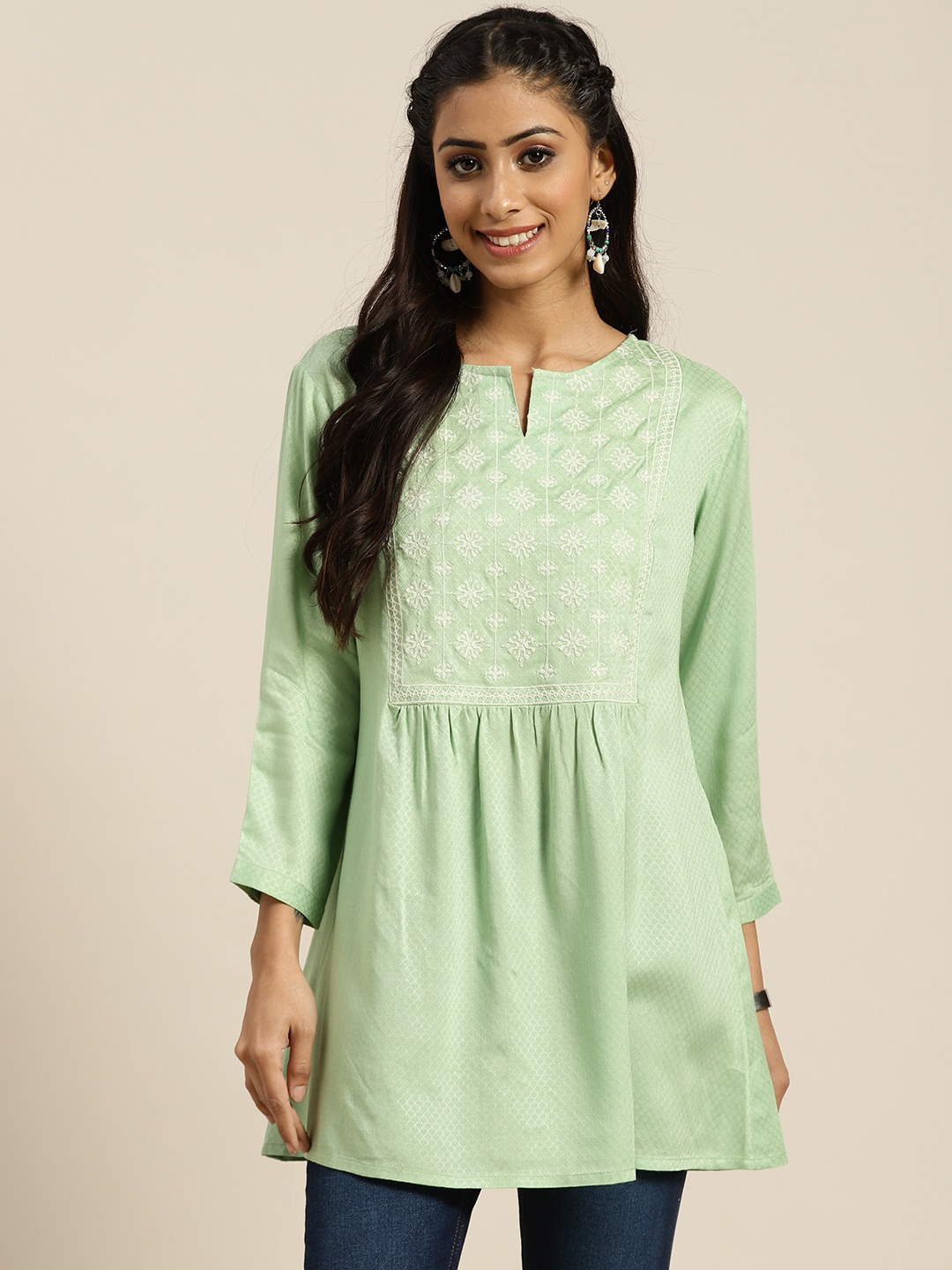 

Sangria Green & White Embroidered Kurti