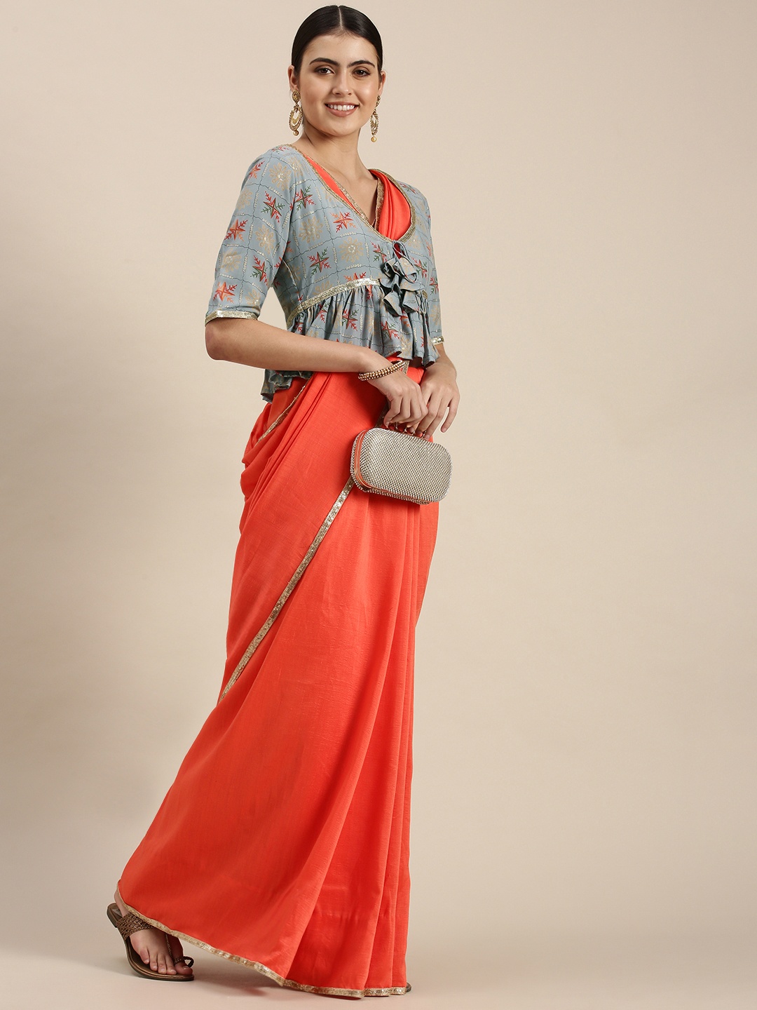 

Ethnovog Coral Orange Sequinned Art Silk Saree