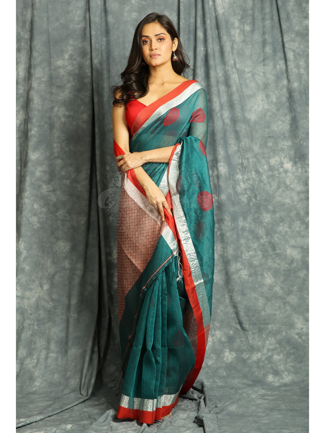 

Charukriti Teal & Silver Woven Design Handloom Saree