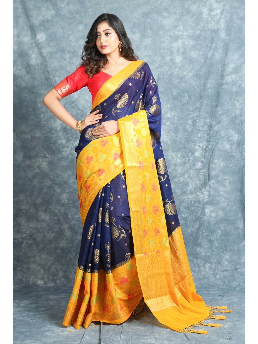 

Charukriti Blue & Yellow Floral Zari Pure Silk Saree