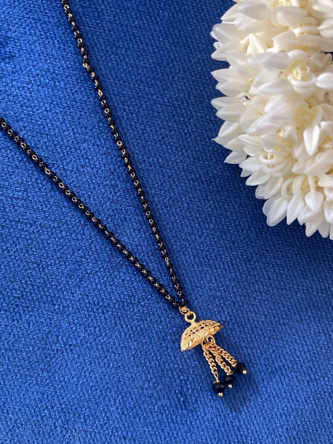 

Digital Dress Room Women Gold-Plated & Black Beaded Mangalsutra