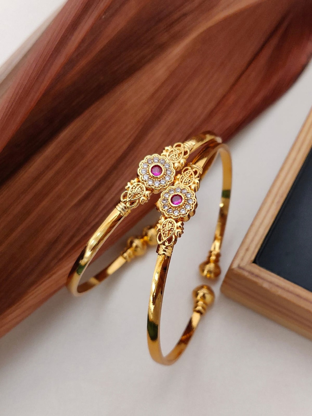 

Shining Diva Set Of 2 Gold-Plated White & Pink Stone-Studded Adjustable Bangles