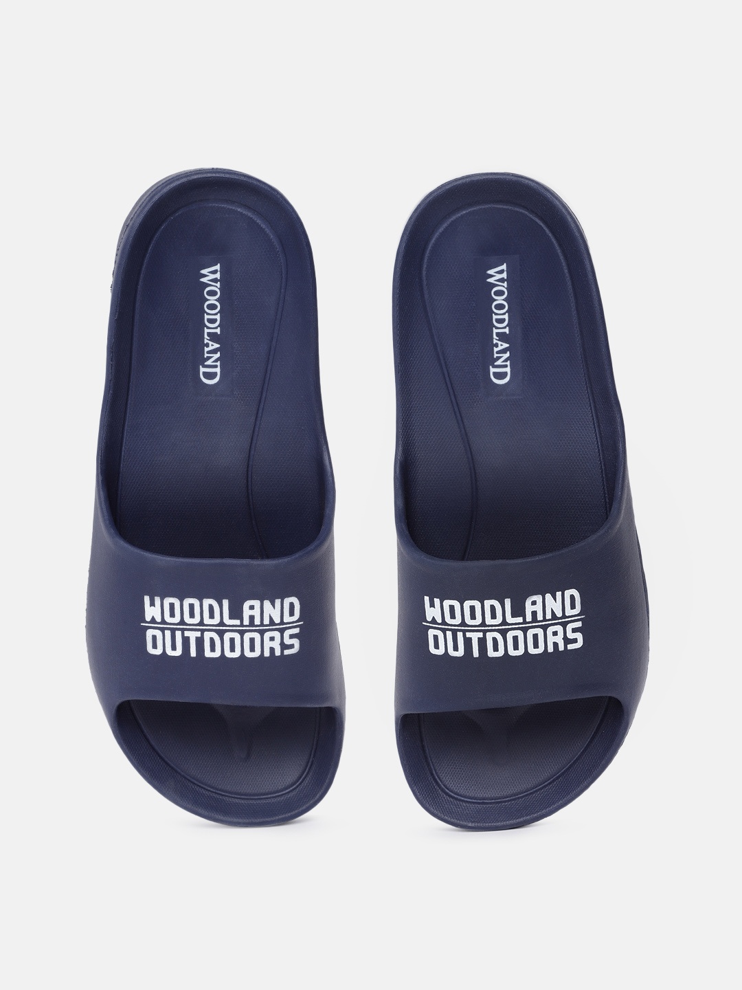 

Woodland Men Navy Blue & White Brand Logo Printed Shock-Resistance Sliders