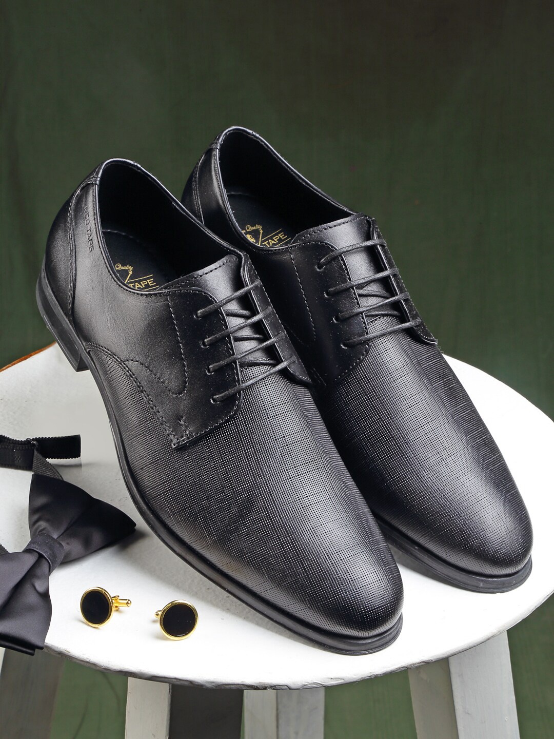 

Red Tape Men Black Textured Leather Formal Derbys