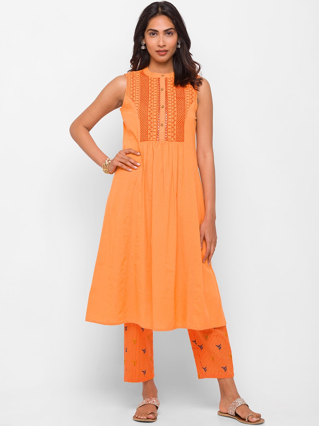 

Globus Women Orange Pleated Mirror Work Pure Cotton Kurti with Trousers
