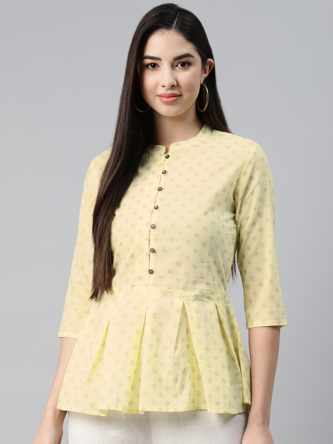 

MALHAAR Yellow Ethnic Motifs Printed Pure Cotton Pleated Kurti