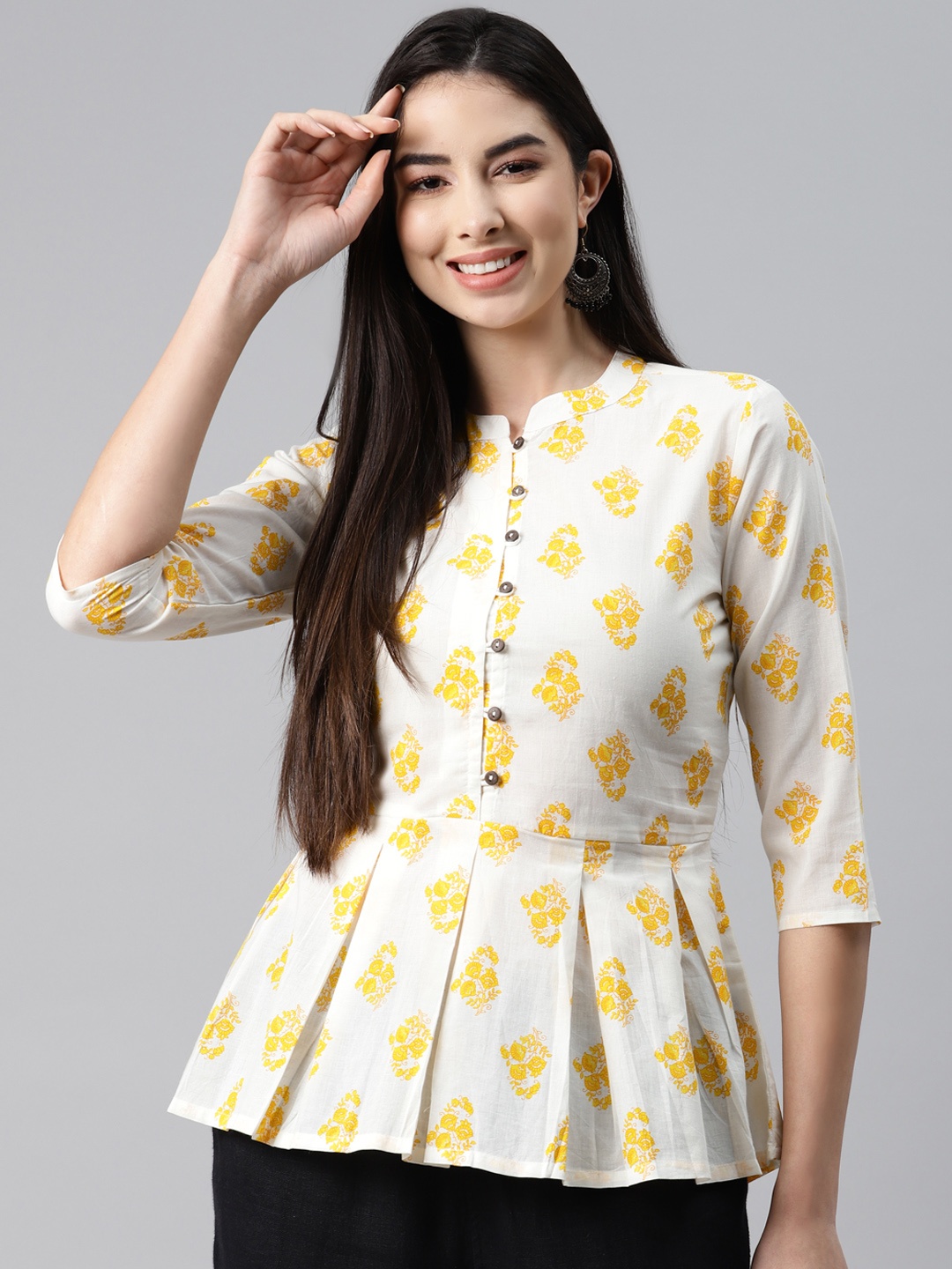 

MALHAAR White & Yellow Ethnic Motifs Printed Cambric Pleated Kurti