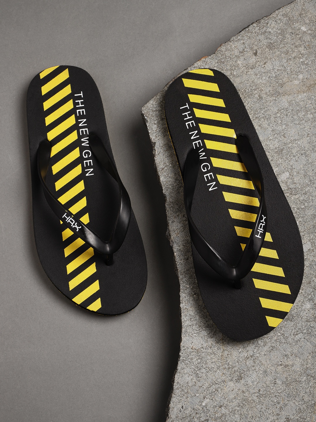 

HRX by Hrithik Roshan Men Black & Yellow Striped Thong Flip-Flops