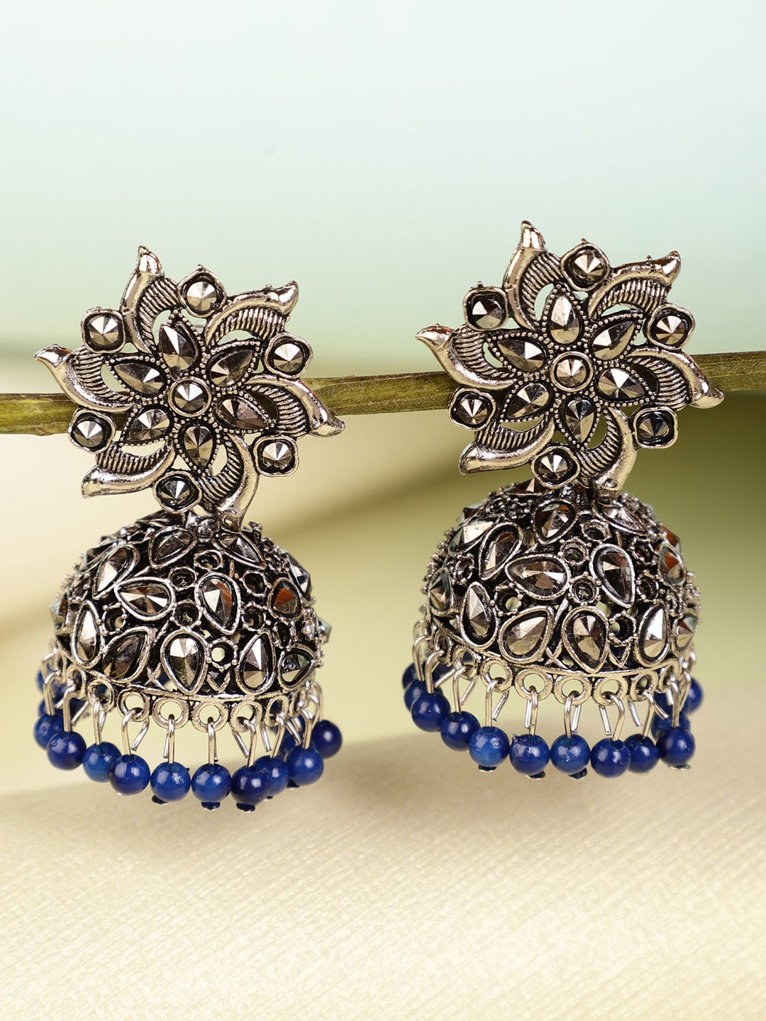 

Shining Diva Silver-Plated Blue & Grey Beaded & Stoned Jhumkas Earrings