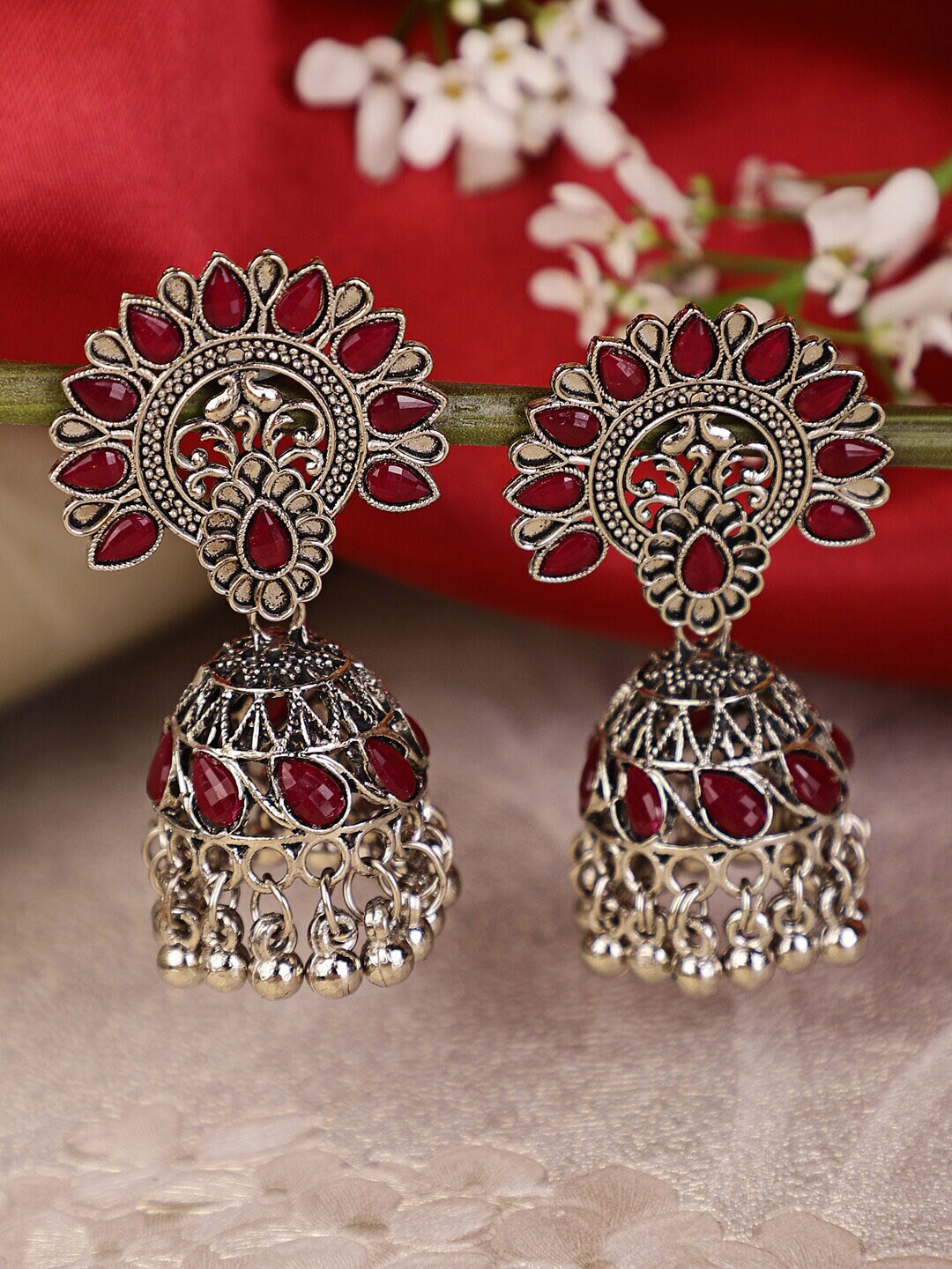 

Shining Diva Silver-Plated Maroon Stone Studded Jhumkas Earrings