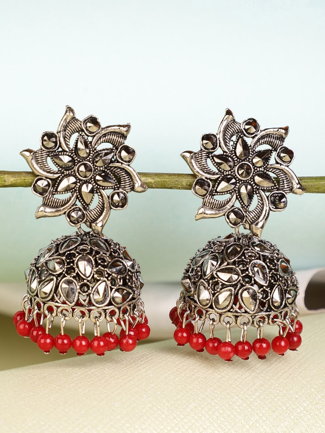 

Shining Diva Silver-Plated Red Dome Shaped Jhumkas Earrings