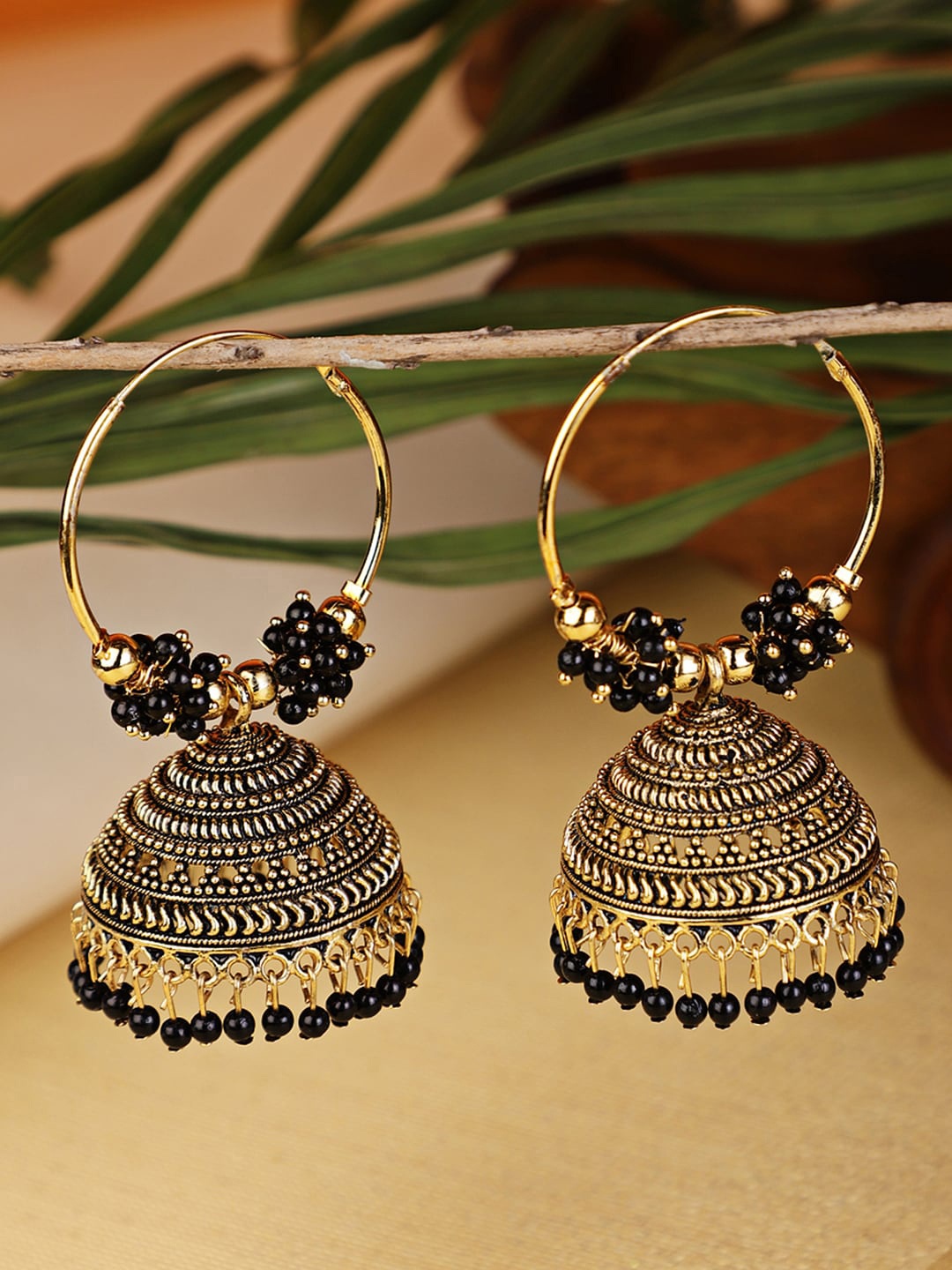 

Shining Diva Black & Gold-Plated Circular Jhumkas