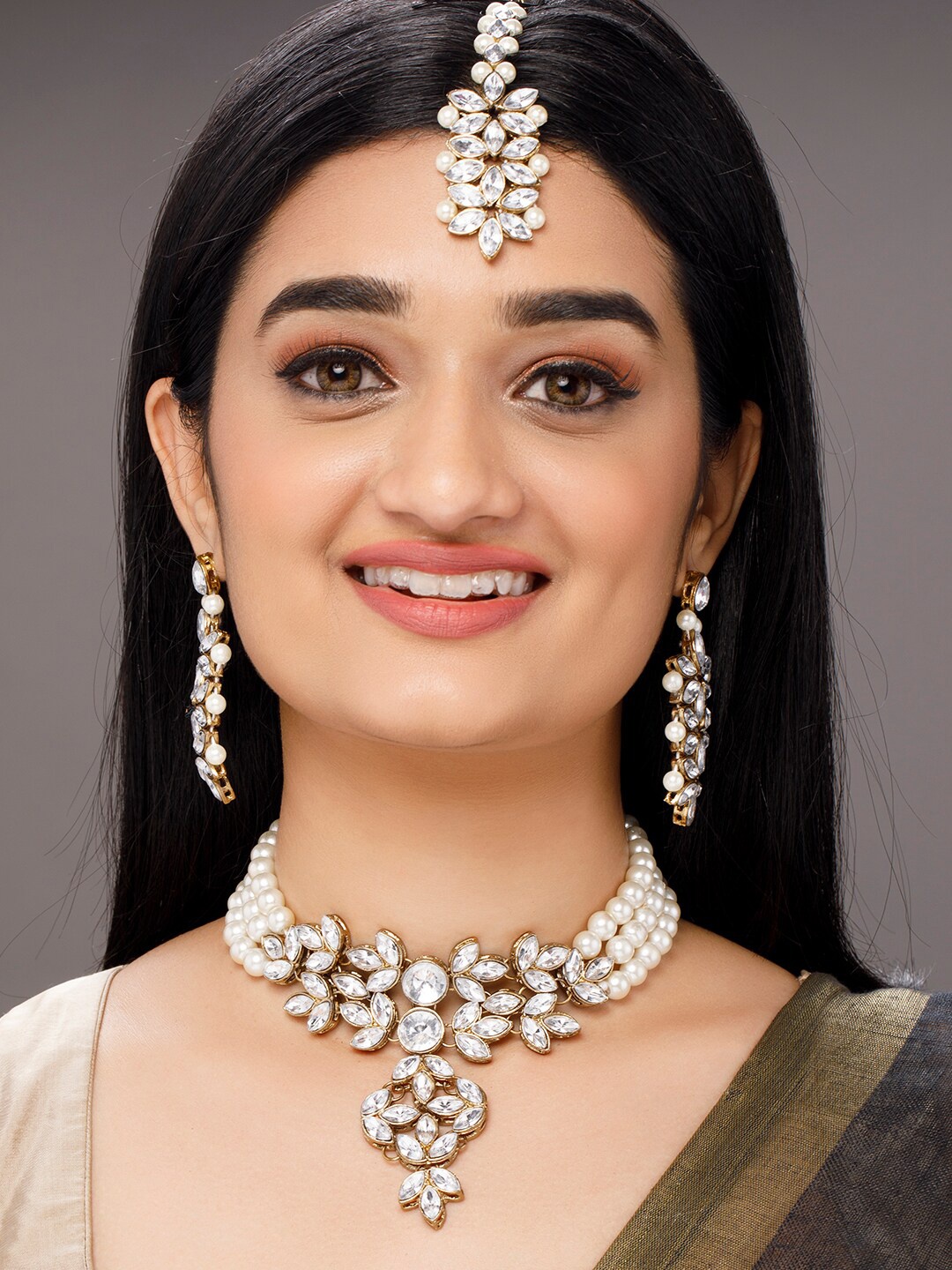 

Anouk Women Gold-Toned & White Stone-Studded & Beaded Jewellery Set