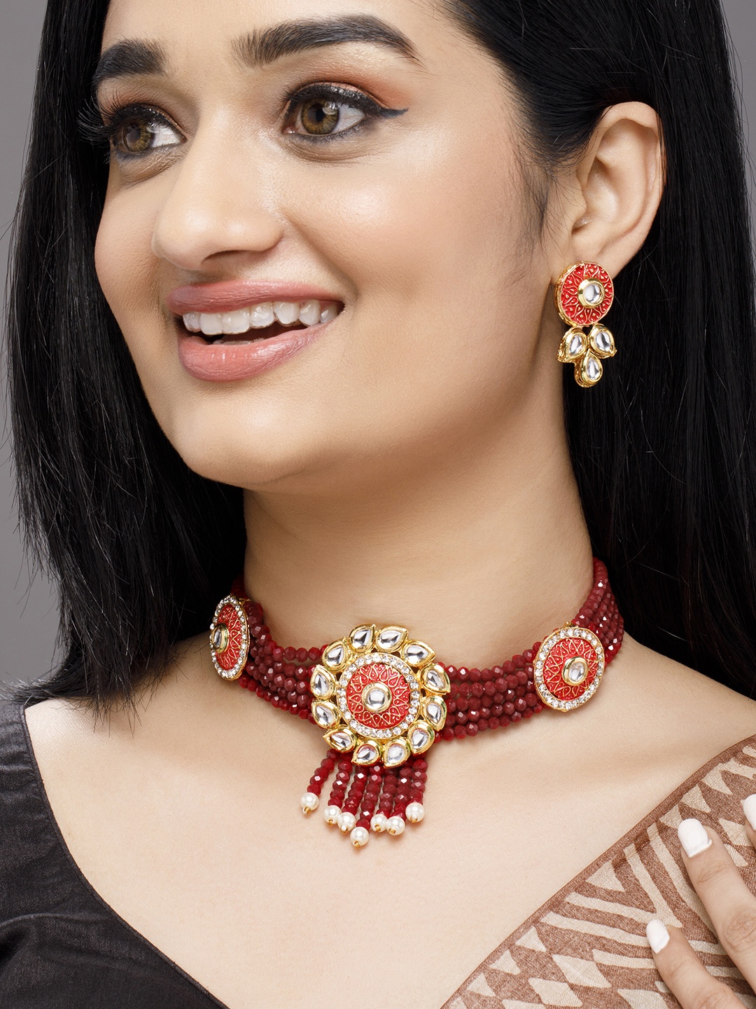 

Anouk Gold-Toned & White Kundan-Studded Jewellery Set