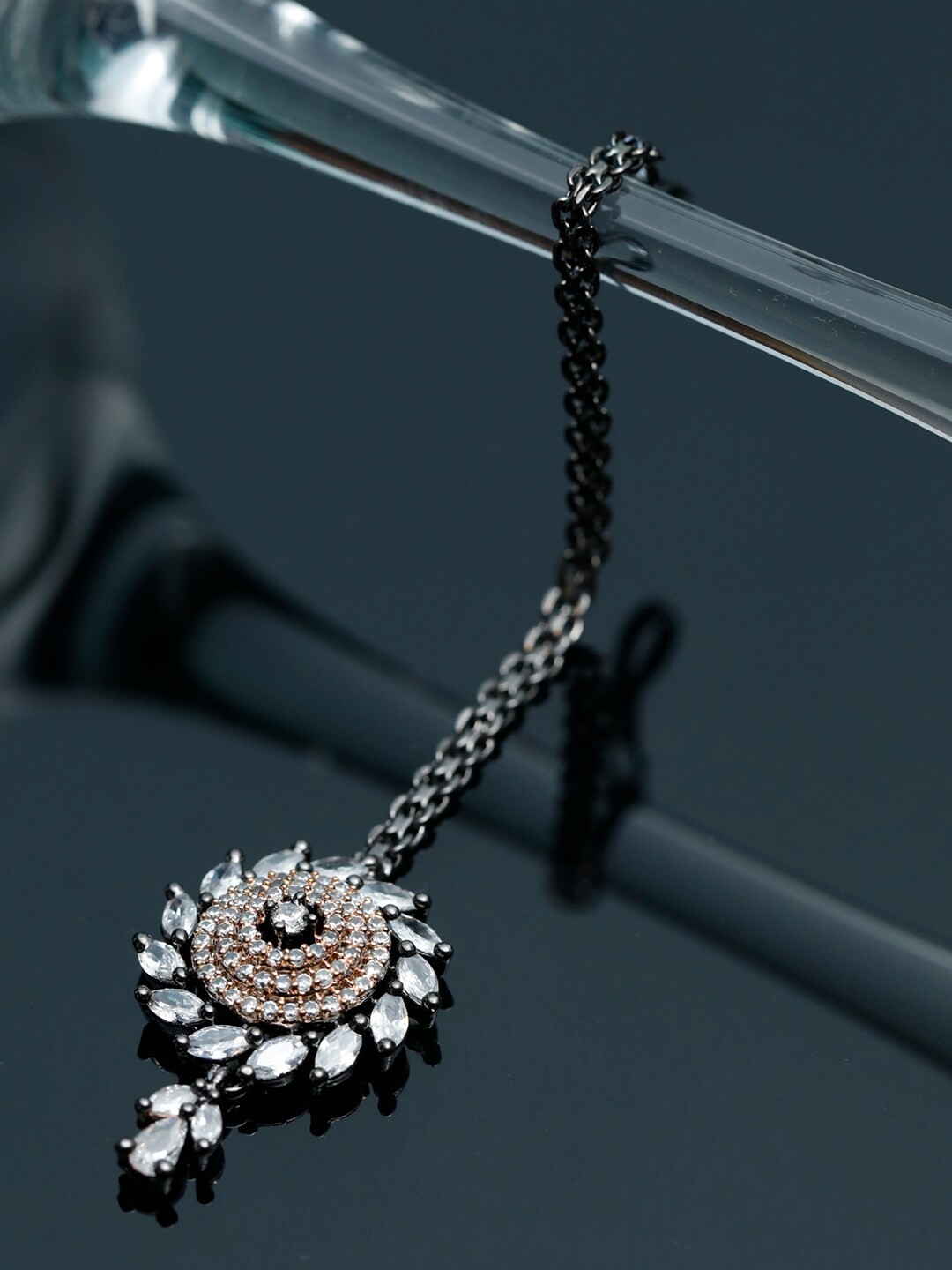 

Priyaasi Silver-Plated White AD-Studded Elegantly Designed Dual Toned Maangtikka