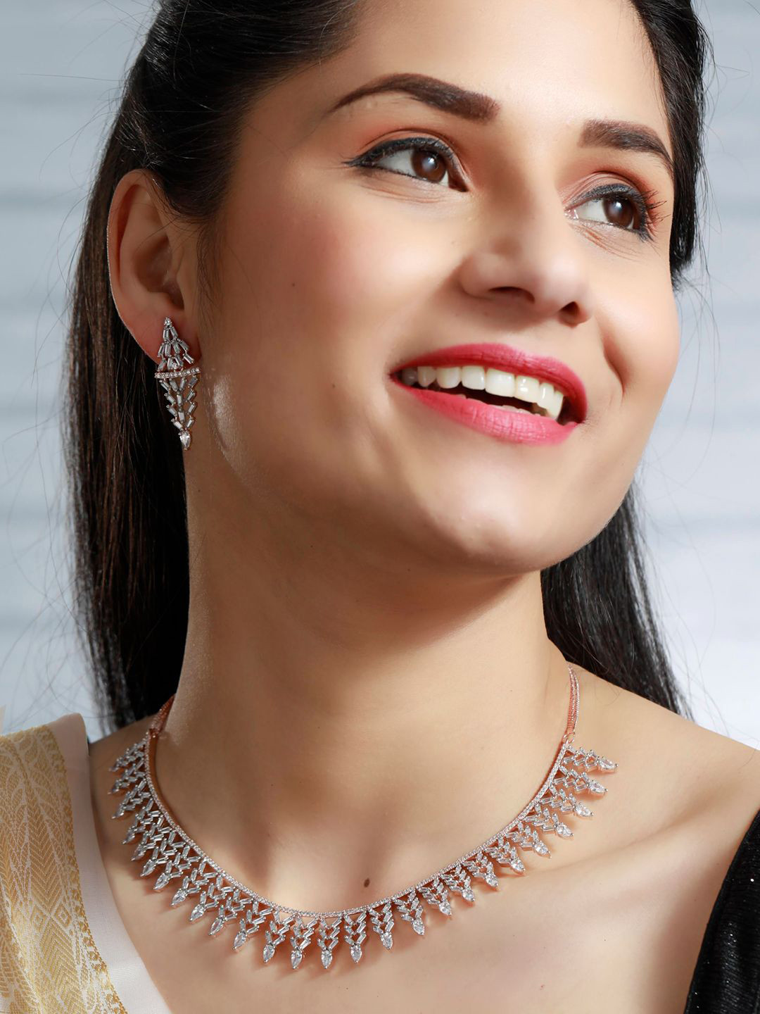 

Priyaasi Rose Gold-Plated White AD Studded Jewellery Set