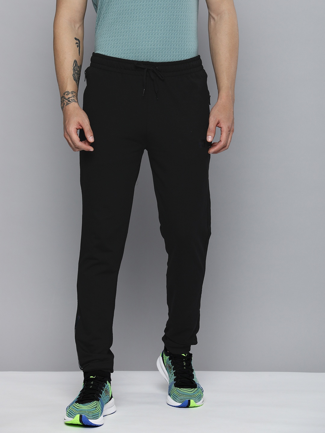 

one8 x PUMA Men Black Brand Logo Printed Slim Fit Regular Track Pants