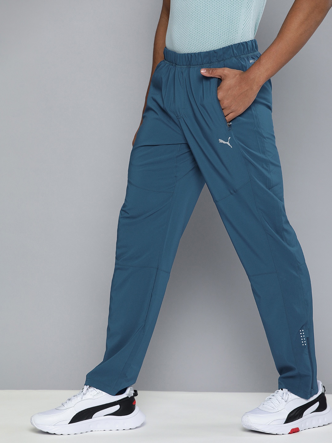 

Puma Men Teal Blue Solid Mid Rise Elasticated Dry Cell Tapered Track Pants