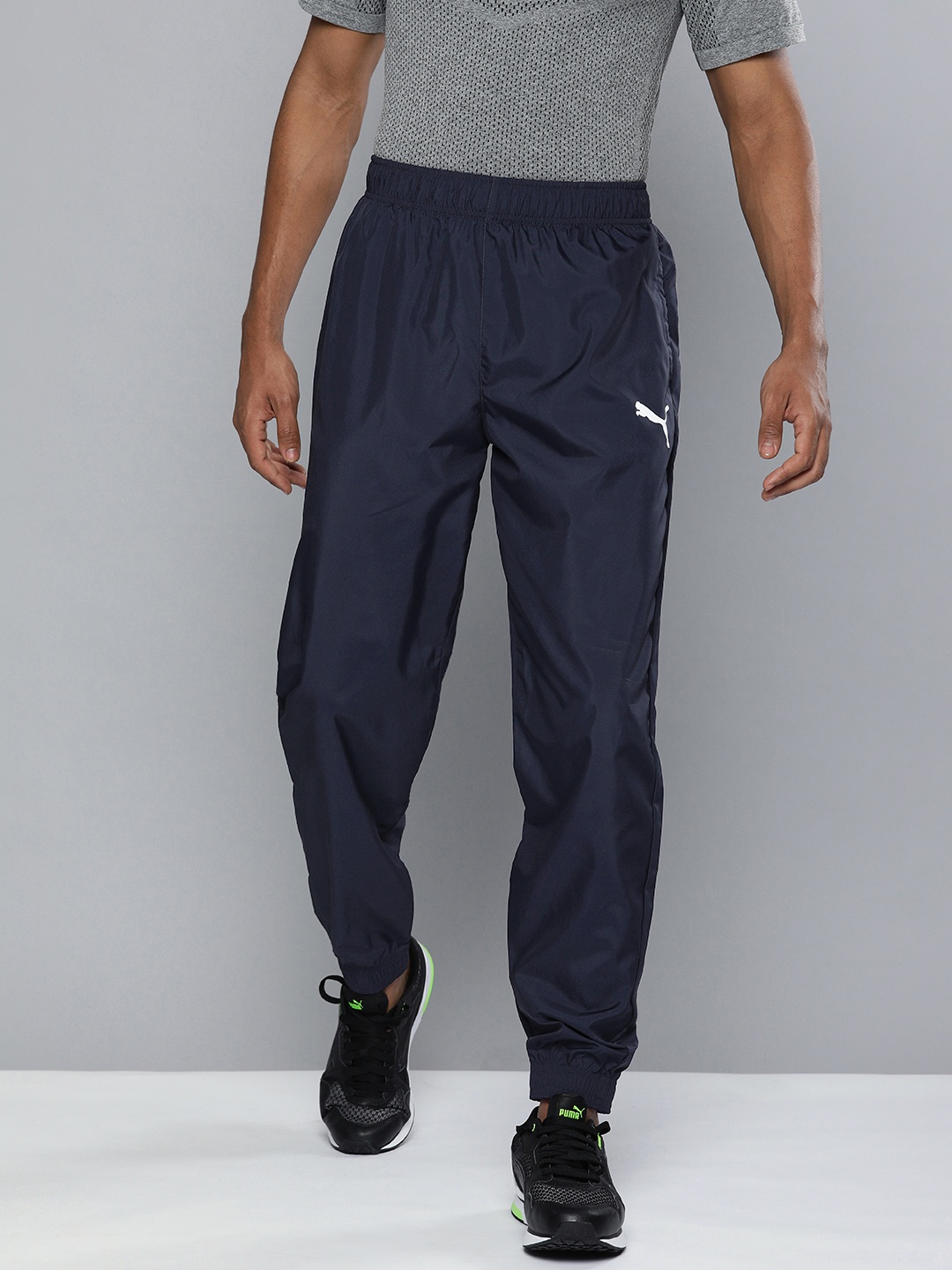 

Puma Men Navy Blue Solid Woven Training Joggers with PUMA Logo Branding