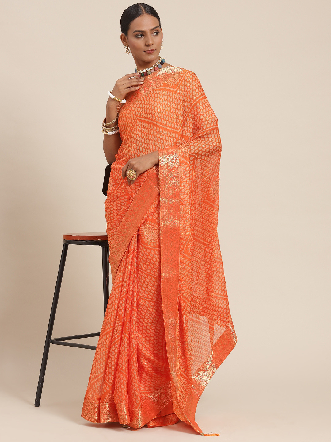 

Satrani Orange Ethnic Motifs Chiffon Saree