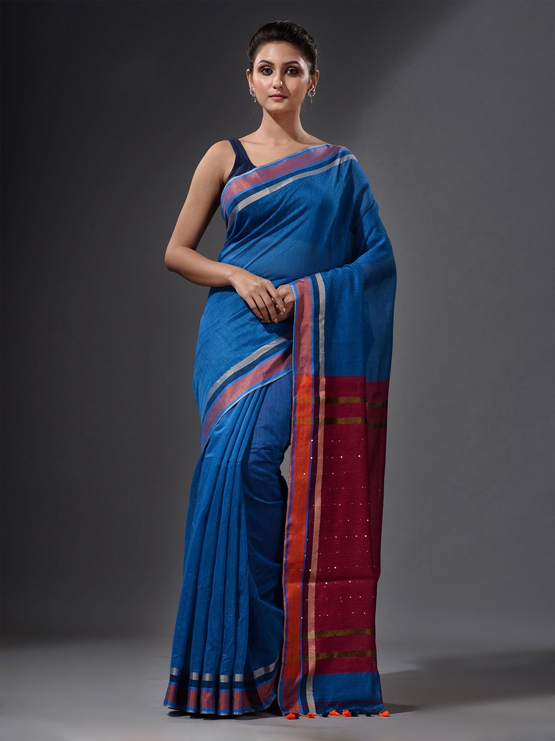 

Charukriti Blue & Maroon Sequinned Saree