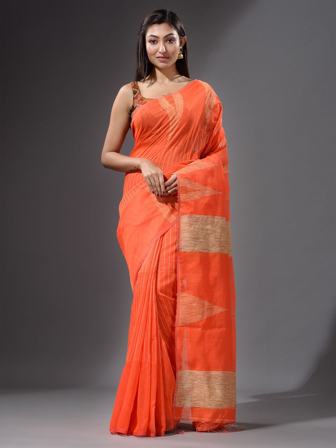 

Charukriti Orange & Beige Embroidered Saree