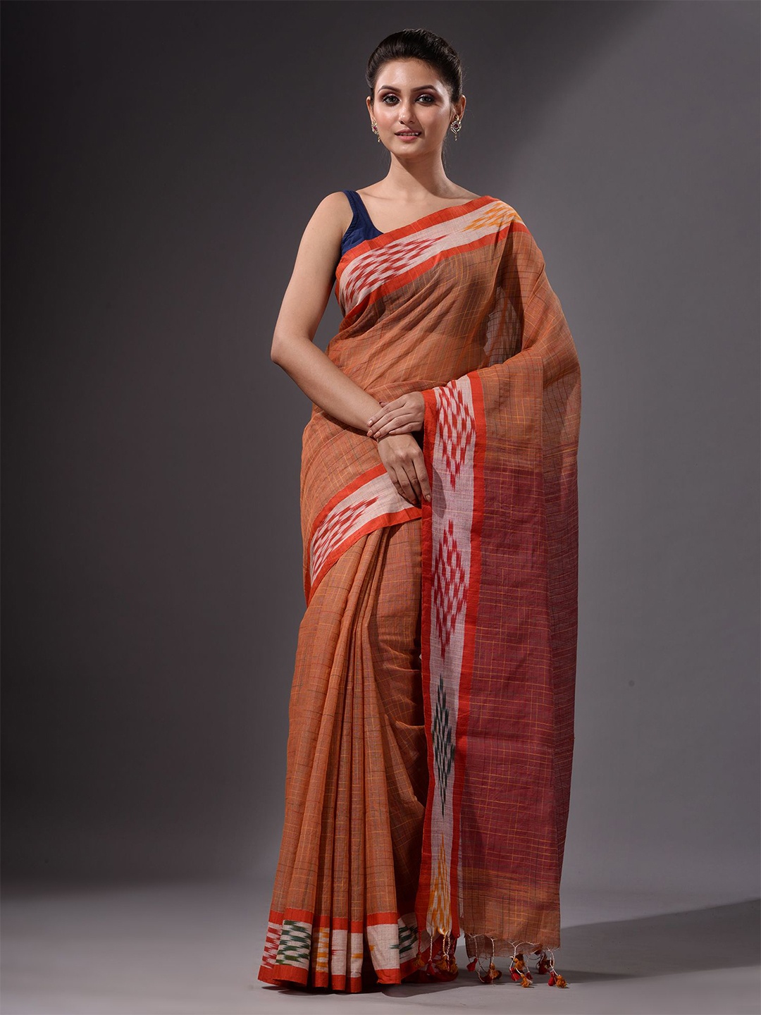 

Charukriti Rust & Orange Checked Saree